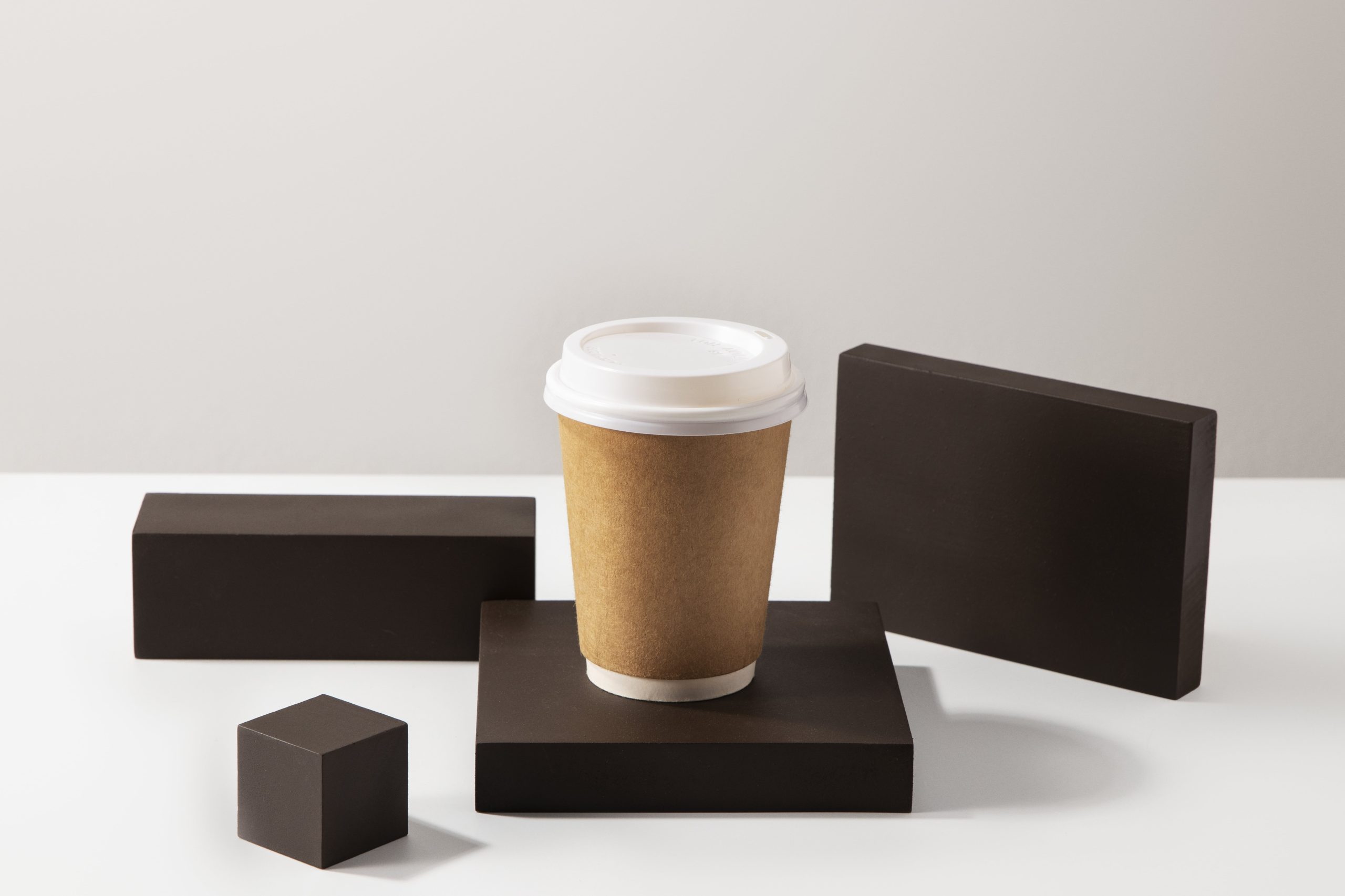 high-angle-coffee-cup-with-wooden-boards(1)-min